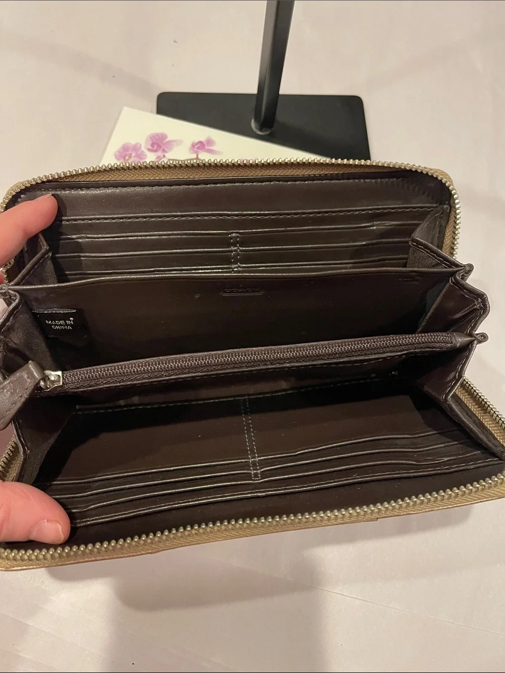 Coach Ashley perforated zip-around wallet.